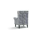 Bliss wing chair upholstered in zebra velvet with dark timber legs