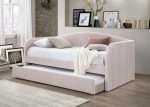 Light Pink Charlotte Day Bed with Trundle in velvet fabric, ideal for small spaces.