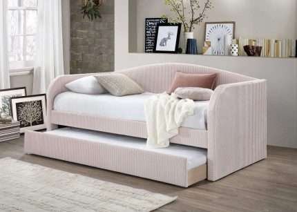 Light Pink Charlotte Day Bed with Trundle in velvet fabric, ideal for small spaces.