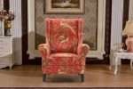 Red and gold chair with bird chinoiserie print in classic room.
