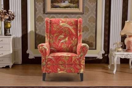 Red and gold chair with bird chinoiserie print in classic room.