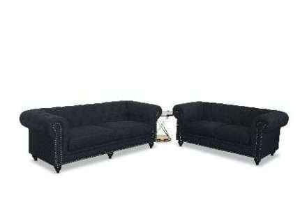 Black Chesterfield 3 Seater Lounge with side table in modern setting
