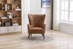 Tan Sherlock wingback chair with faux leather in stylish living space