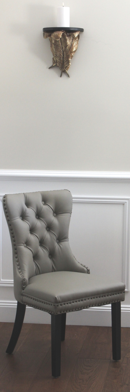 Elegant Elena Chair in Grey Faux Leather with tufted back.