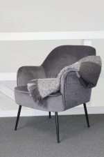 Luxurious Ivy Chair in seal velvet with quilted back and steel legs
