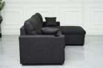 Black Romy sofa bed with storage chaise in modern living room