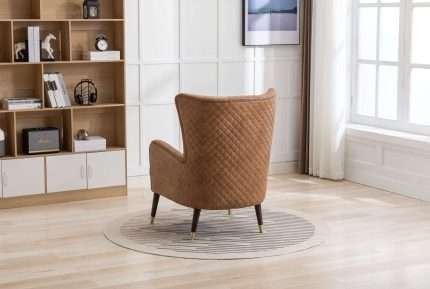 Sherlock Wingback Chair in tan faux leather with wood legs