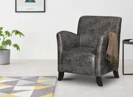 Theodore Arm Chair in dark grey vintage faux leather in a room setup